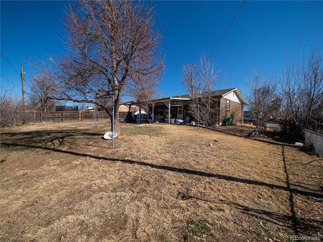 rear view of house with fence