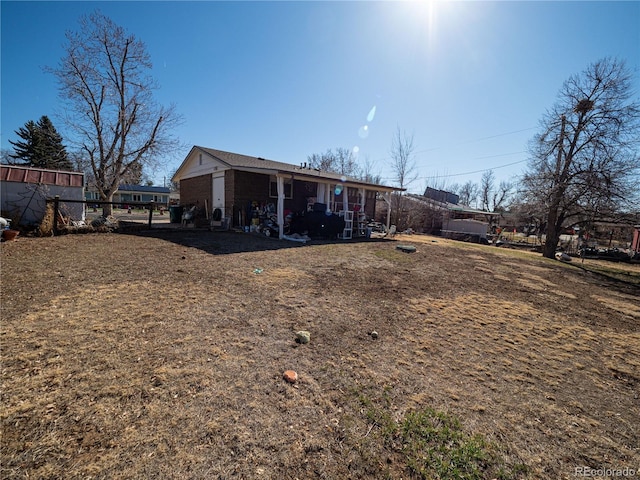 back of property with fence