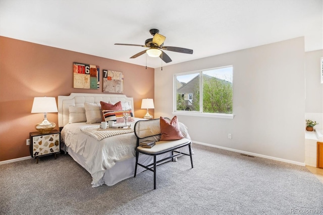 bedroom featuring baseboards, visible vents, ceiling fan, and carpet