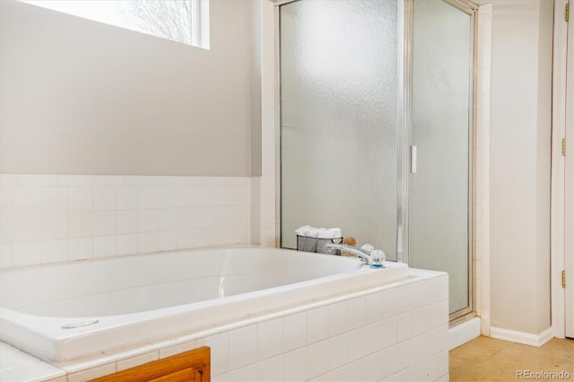 full bath with a garden tub and a shower stall