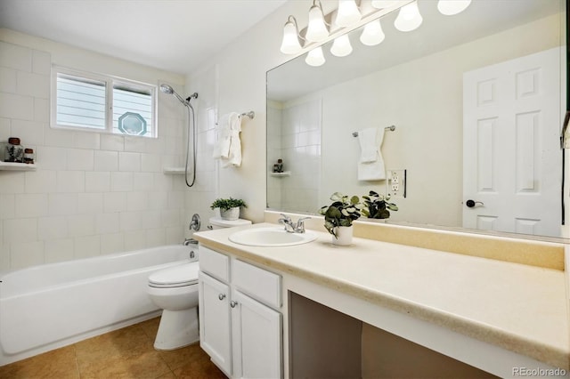 bathroom with tile patterned floors, washtub / shower combination, vanity, and toilet
