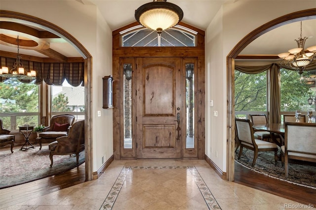 foyer entrance featuring a notable chandelier