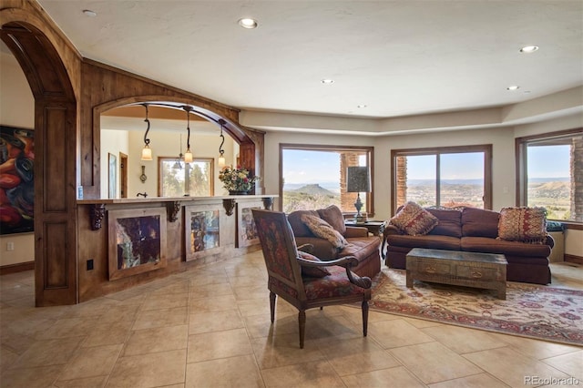 living room featuring light tile patterned flooring and a mountain view