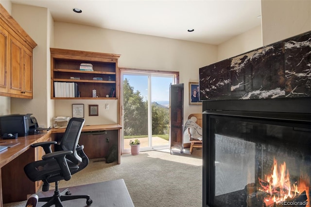 office featuring built in desk and carpet floors