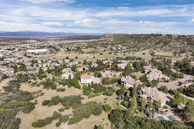 birds eye view of property featuring a mountain view