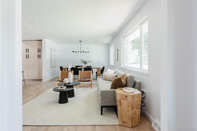 living room with light hardwood / wood-style flooring