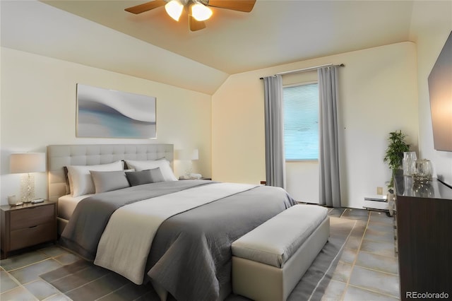 bedroom with a baseboard heating unit, ceiling fan, and vaulted ceiling