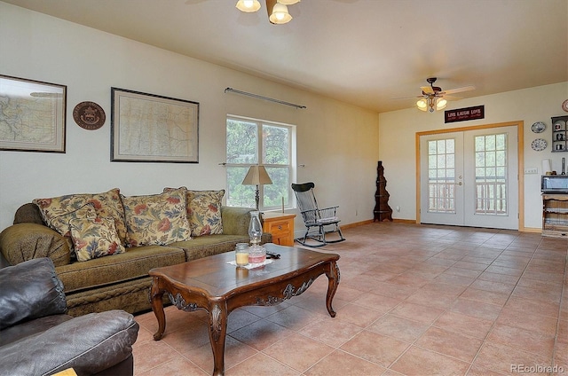 living room featuring french doors, light tile patterned flooring, and ceiling fan