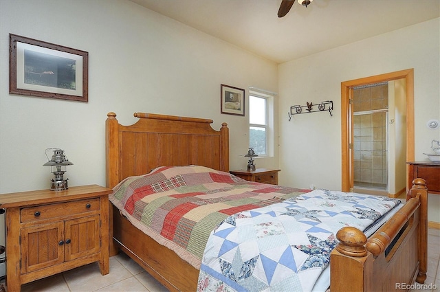 tiled bedroom with ensuite bathroom and ceiling fan