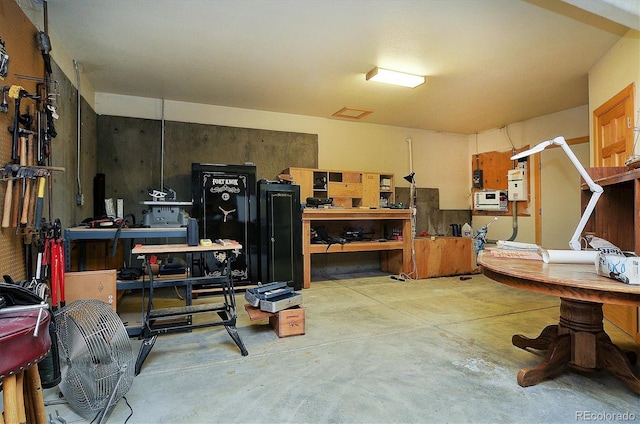 interior space with a workshop area and concrete floors