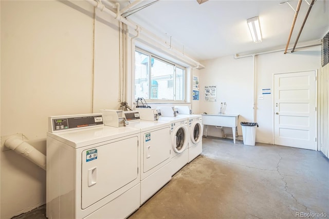 common laundry area with washing machine and dryer and a sink