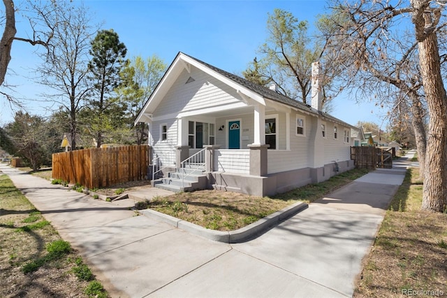 1130 E Yampa St, Colorado Springs, CO 80903 - view of front of property featuring fence and a porch