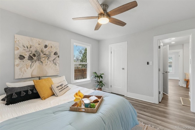 1130 E Yampa St, Colorado Springs, CO 80903 - bedroom featuring visible vents, baseboards, wood finished floors, and ceiling fan