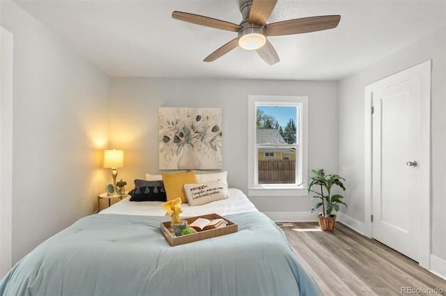 1130 E Yampa St, Colorado Springs, CO 80903 - bedroom featuring baseboards, a ceiling fan, and wood finished floors