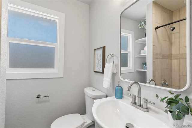 1130 E Yampa St, Colorado Springs, CO 80903 - bathroom featuring a sink, a shower, and toilet
