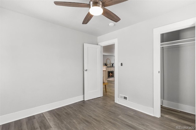 1130 E Yampa St, Colorado Springs, CO 80903 - unfurnished bedroom featuring dark wood-style floors, baseboards, visible vents, and a closet