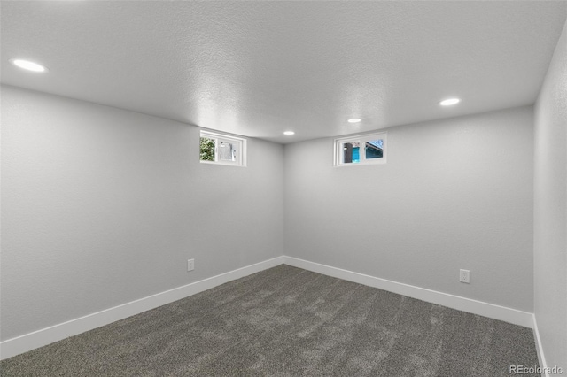1130 E Yampa St, Colorado Springs, CO 80903 - below grade area featuring dark carpet, baseboards, a textured ceiling, and recessed lighting