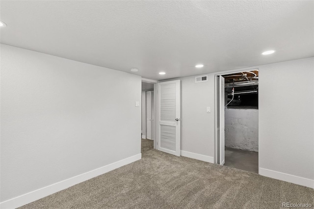 1130 E Yampa St, Colorado Springs, CO 80903 - unfurnished bedroom with recessed lighting, a spacious closet, visible vents, carpet floors, and baseboards