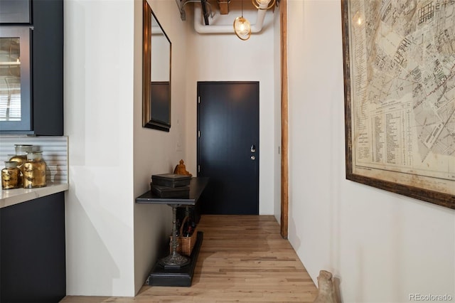 corridor featuring light hardwood / wood-style floors