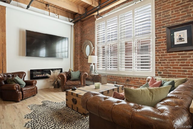 living room featuring brick wall, hardwood / wood-style floors, wooden ceiling, and beam ceiling