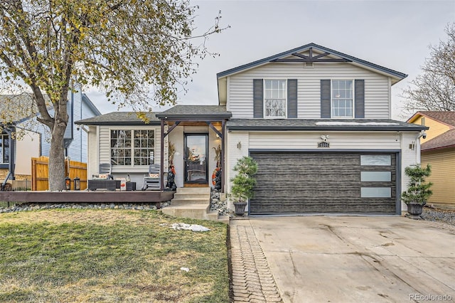 view of front of house with a garage and a front yard