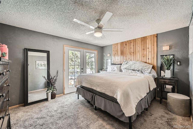 carpeted bedroom with access to outside, ceiling fan, and a textured ceiling