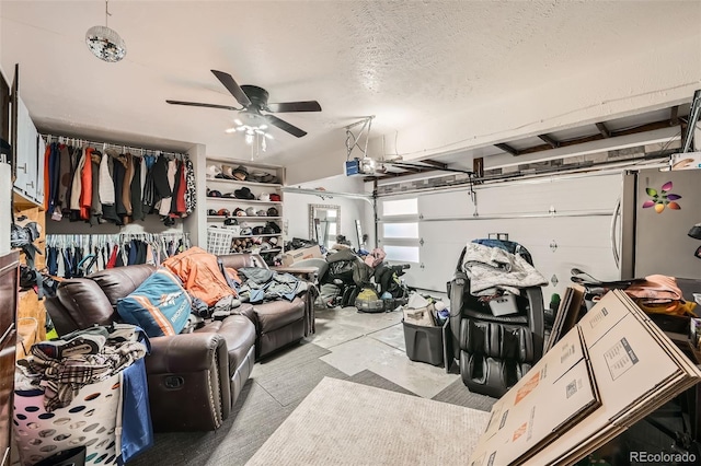 garage with stainless steel fridge, ceiling fan, and a garage door opener