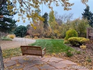 surrounding community featuring a yard and a patio area