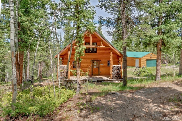 987 Boreas Cir, Jefferson, CO 80456 - log home with covered porch and an outdoor structure