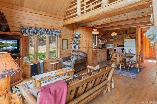 987 Boreas Cir, Jefferson, CO 80456 - living room with wood ceiling, wood walls, light wood-style flooring, and lofted ceiling