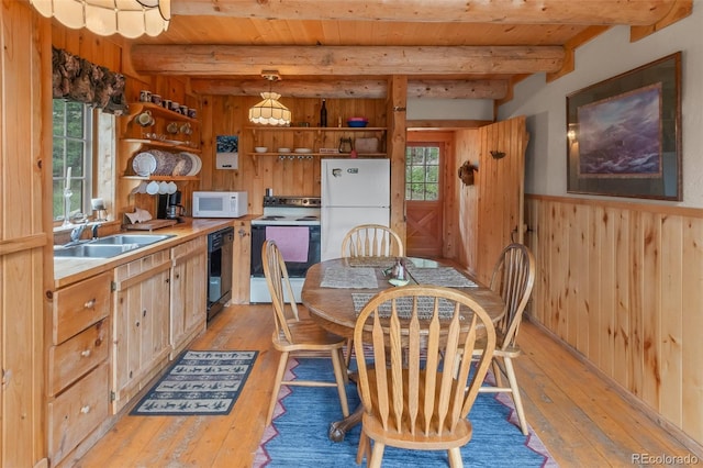 987 Boreas Cir, Jefferson, CO 80456 - dining area featuring light wood-type flooring, a wood ceiling with exposed beams, wood walls, healthy amount of natural light, and wainscoting