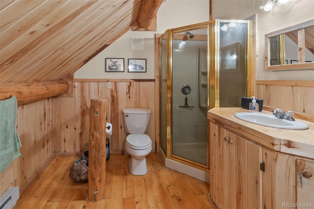 987 Boreas Cir, Jefferson, CO 80456 - full bath featuring a baseboard radiator, lofted ceiling, a stall shower, vanity, and wood-type flooring