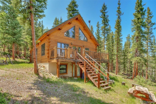 987 Boreas Cir, Jefferson, CO 80456 - rear view of house featuring log siding, a deck, and stairway