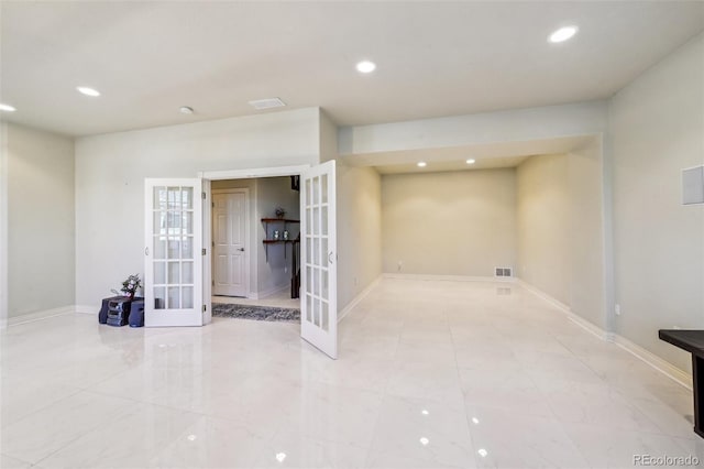 below grade area with french doors, recessed lighting, and baseboards