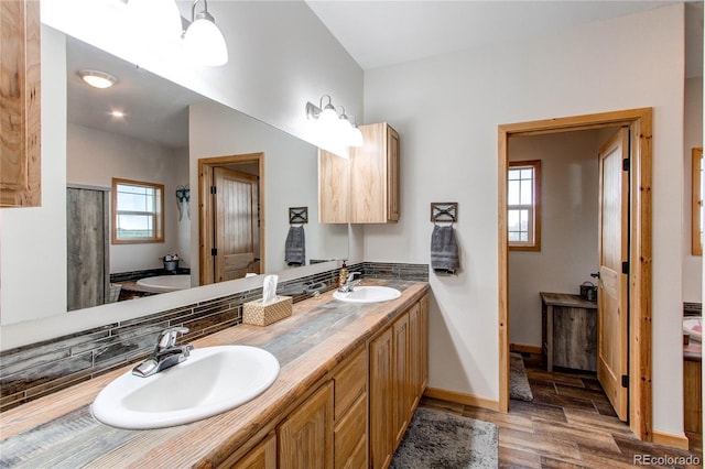 42919 Vista Rdg, Parker, CO 80138 - full bath featuring double vanity, wood finished floors, and a shower