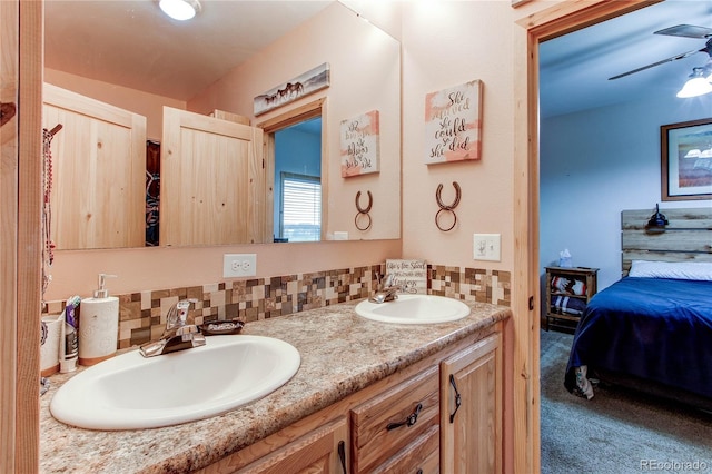 42919 Vista Rdg, Parker, CO 80138 - bathroom featuring connected bathroom, double vanity, decorative backsplash, and ceiling fan