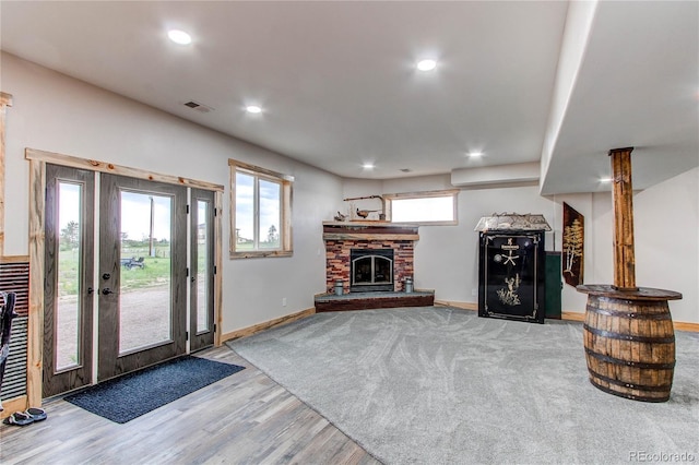 42919 Vista Rdg, Parker, CO 80138 - living room with wood finished floors, a stone fireplace, and recessed lighting