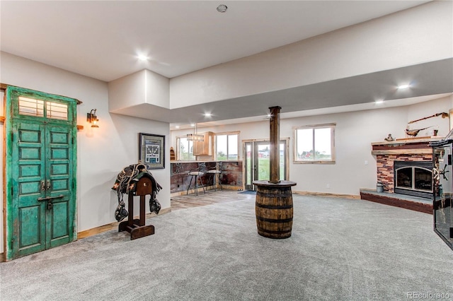 42919 Vista Rdg, Parker, CO 80138 - carpeted living room featuring recessed lighting and a glass covered fireplace
