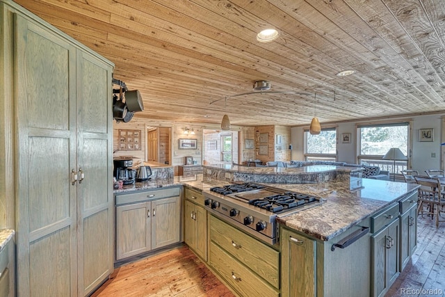 kitchen with light wood-type flooring, wood ceiling, pendant lighting, dark stone countertops, and stainless steel gas stovetop