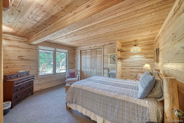 bedroom featuring wood walls, wood ceiling, carpet floors, and a closet