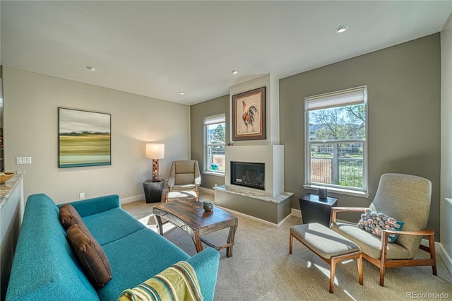 322 W Park Ave, Salida, CO 81201 - living room with a glass covered fireplace, healthy amount of natural light, carpet, baseboards, and recessed lighting