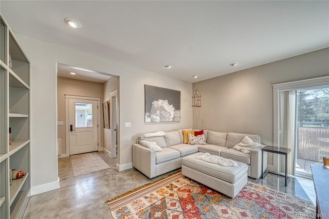 322 W Park Ave, Salida, CO 81201 - living area featuring baseboards, concrete floors, and recessed lighting