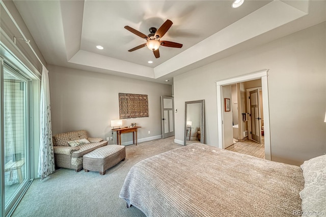 322 W Park Ave, Salida, CO 81201 - bedroom with light colored carpet, recessed lighting, a tray ceiling, baseboards, and connected bathroom
