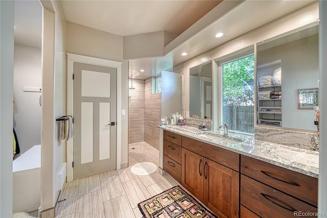 322 W Park Ave, Salida, CO 81201 - bathroom with walk in shower, vanity, and recessed lighting