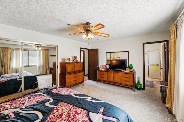 7590 E Easter Pl, Centennial, CO 80112 - bedroom with light colored carpet, a textured ceiling, a closet, and a ceiling fan