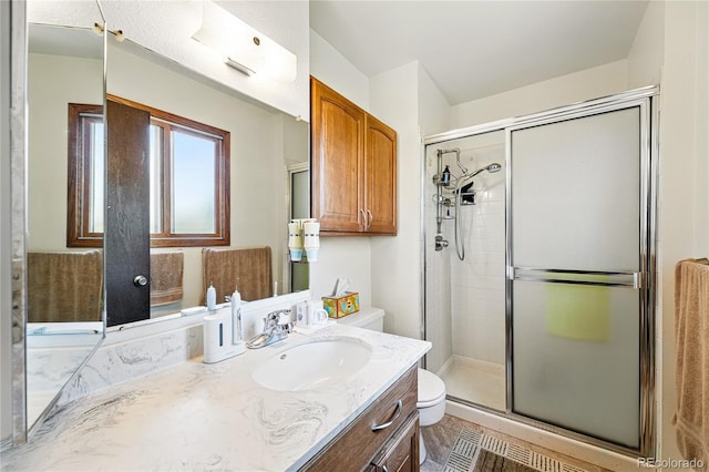 7590 E Easter Pl, Centennial, CO 80112 - full bath featuring toilet, a shower stall, and vanity