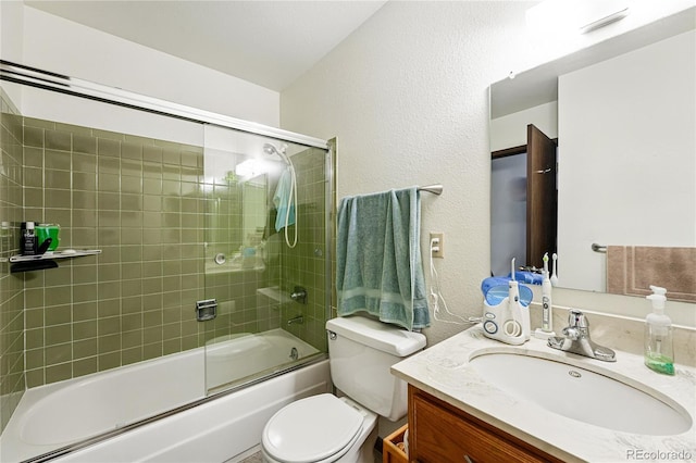 7590 E Easter Pl, Centennial, CO 80112 - full bath with a textured wall, vanity, toilet, and enclosed tub / shower combo