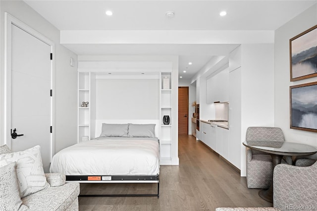 bedroom with light wood-style flooring and recessed lighting