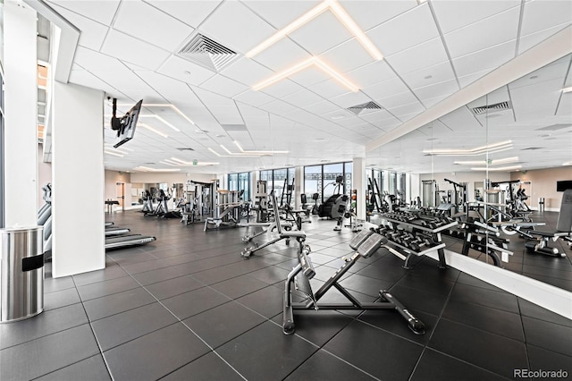 workout area with visible vents and a drop ceiling