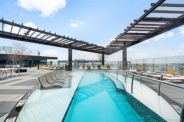 view of swimming pool featuring a patio area